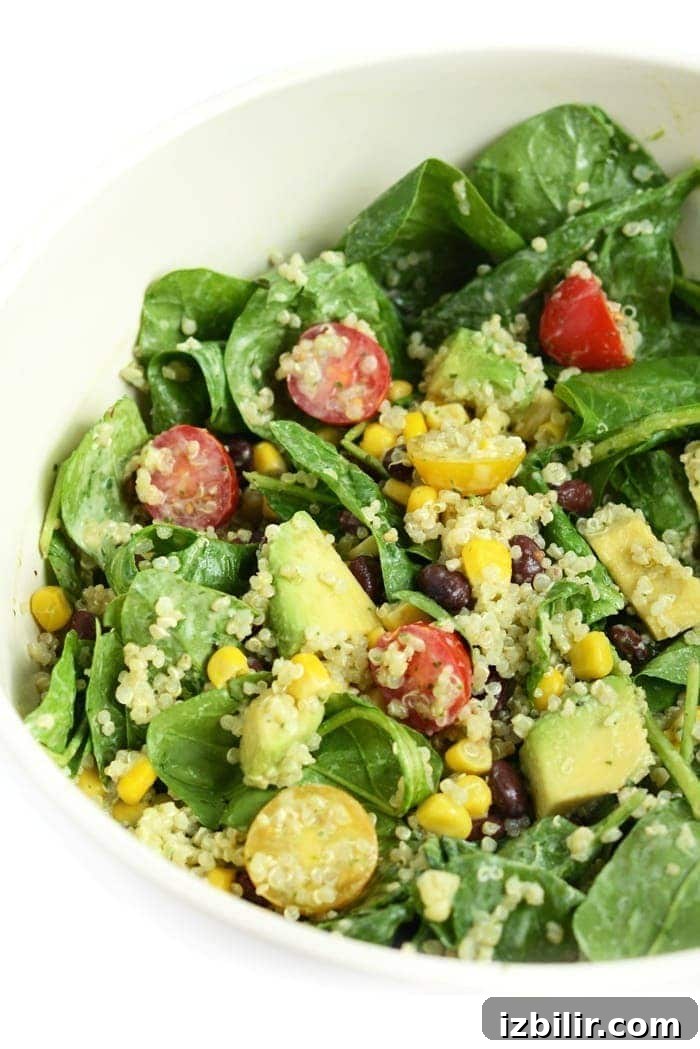 Mason Jar salad poured and mixed in a bowl.