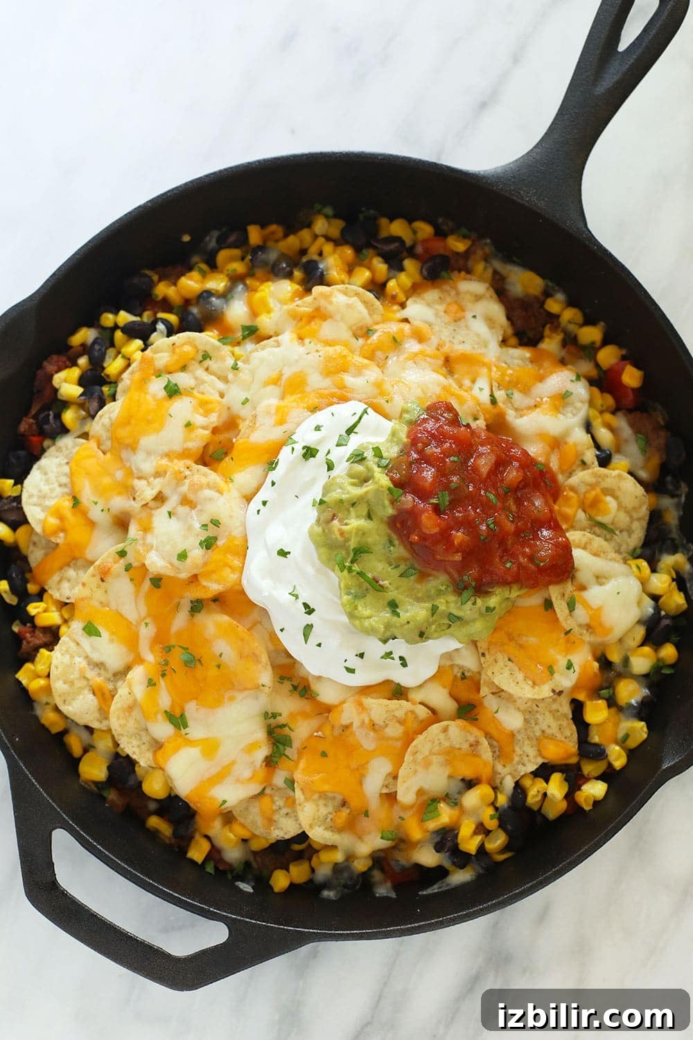 Cheesy Taco Casserole Recipe with Ground Beef 2 easy taco casserole in a cast iron skillet