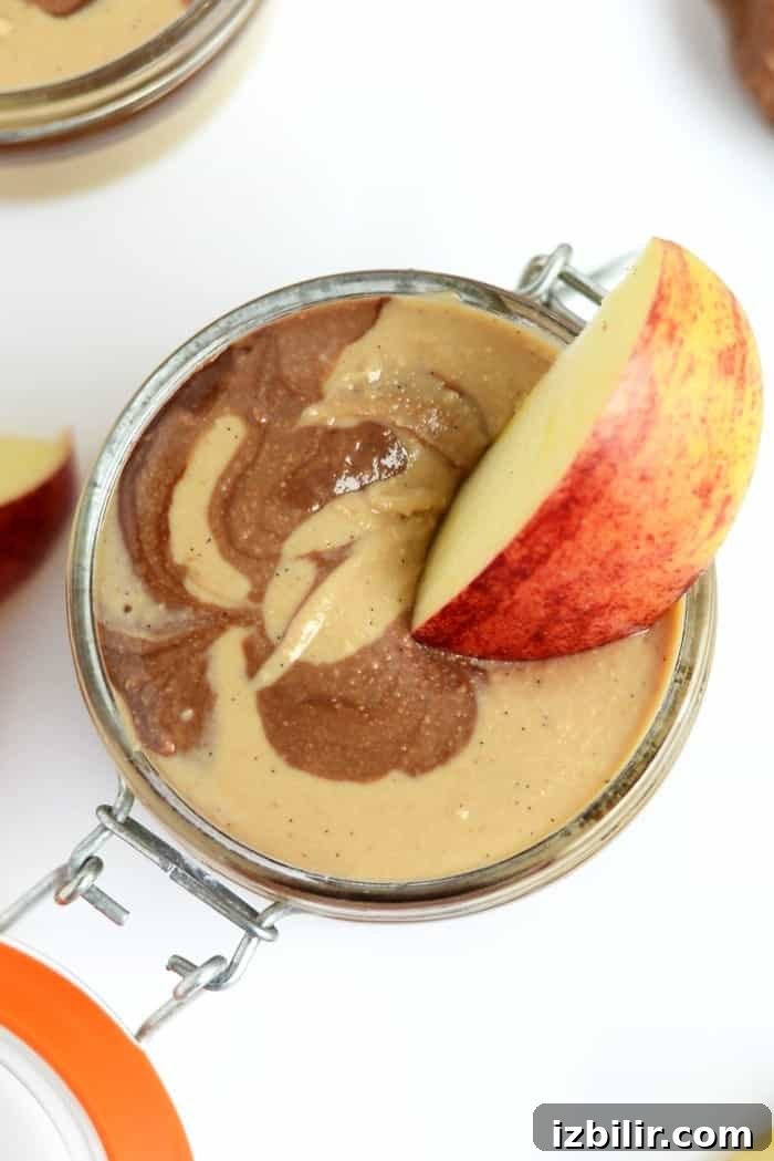 Apples dipped in Chocolate Vanilla Swirl Cashew Butter.