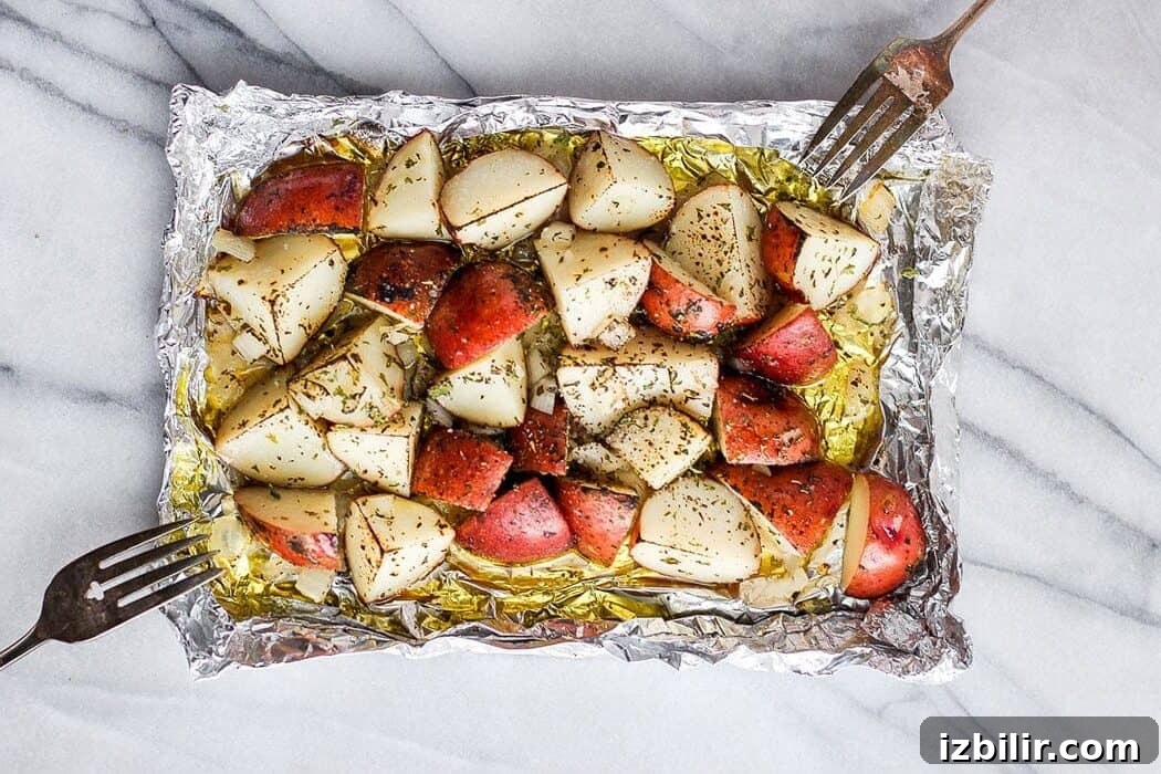 Grilled potatoes in foil grilled potatoes on a piece of foil