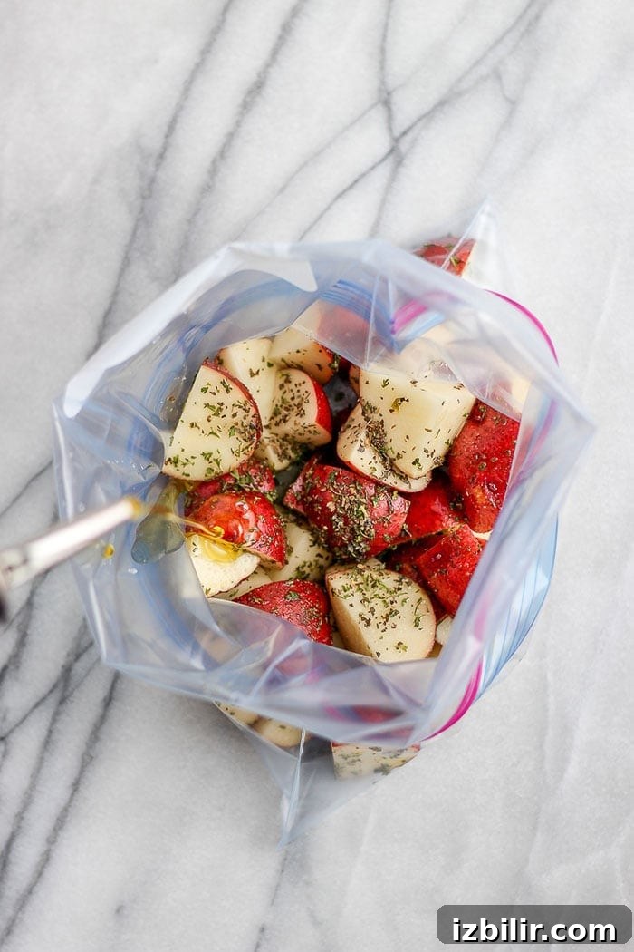 Seasoned potatoes in bag red potatoes and spices in a plastic bag