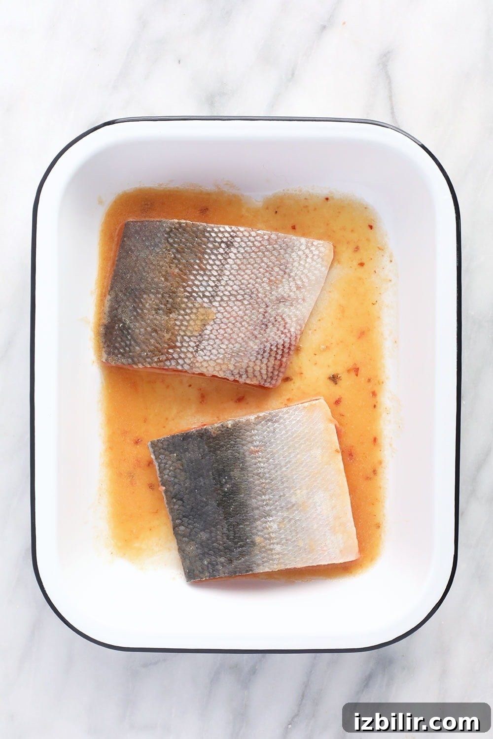 salmon marinading in pan