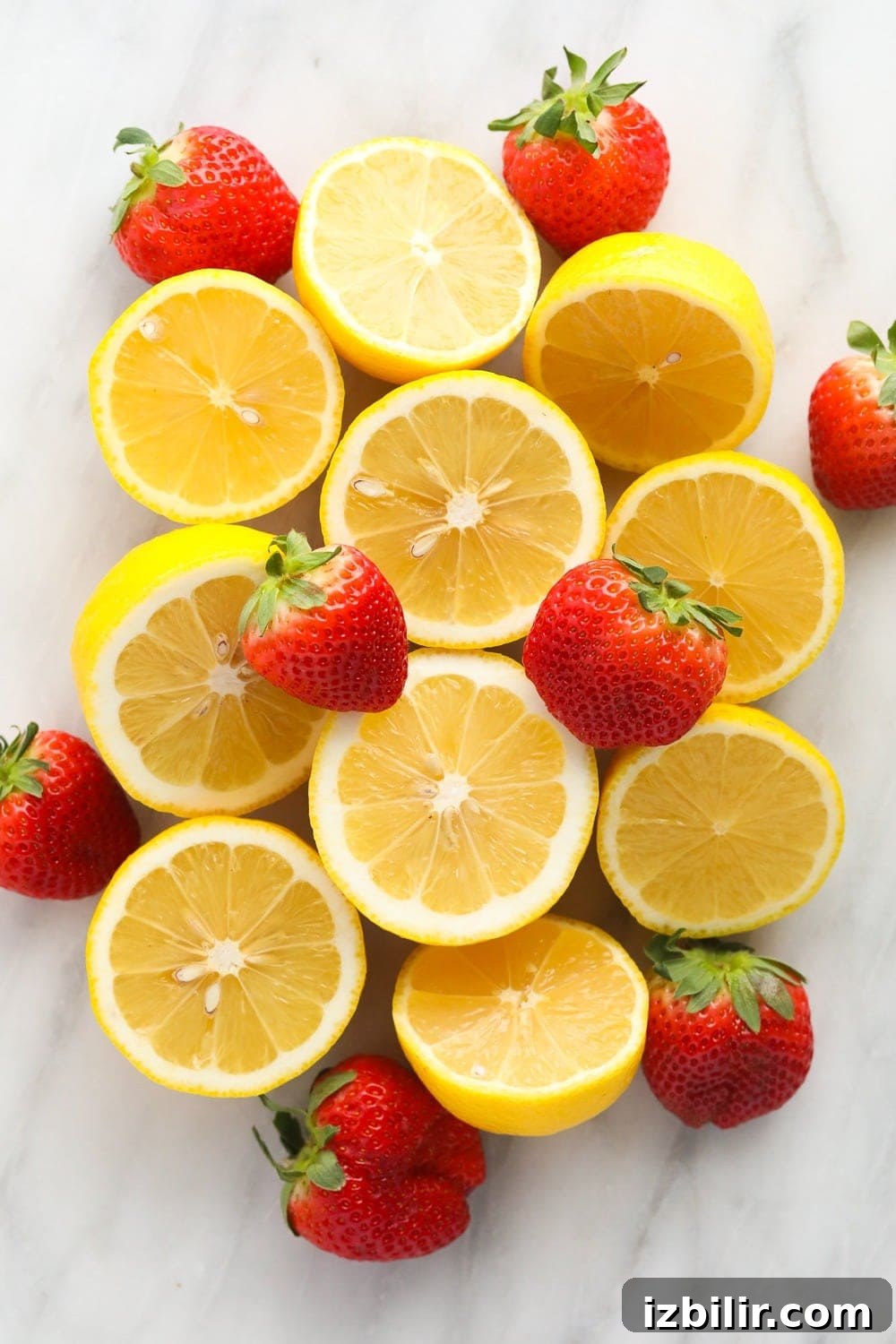 Fresh lemons and strawberries ready to be made into strawberry vodka lemonade