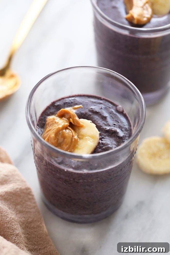 Pumpkin Berry Cashew Butter Smoothie pumpkin berry smoothie with cashew butter in a glass