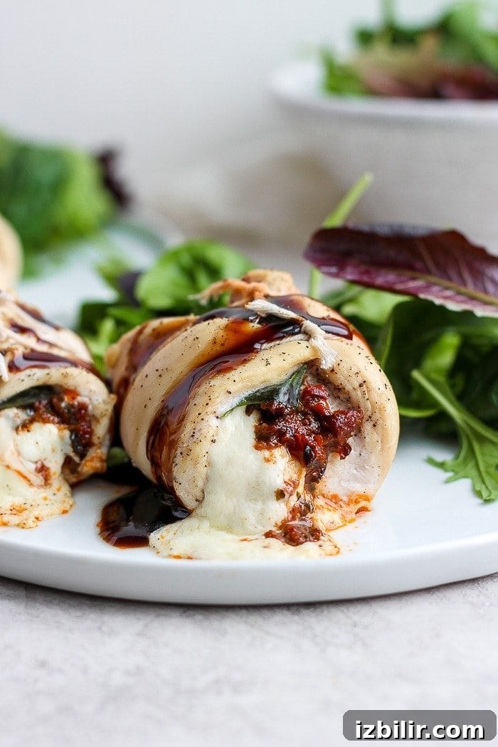 Stuffed chicken breast on a plate.