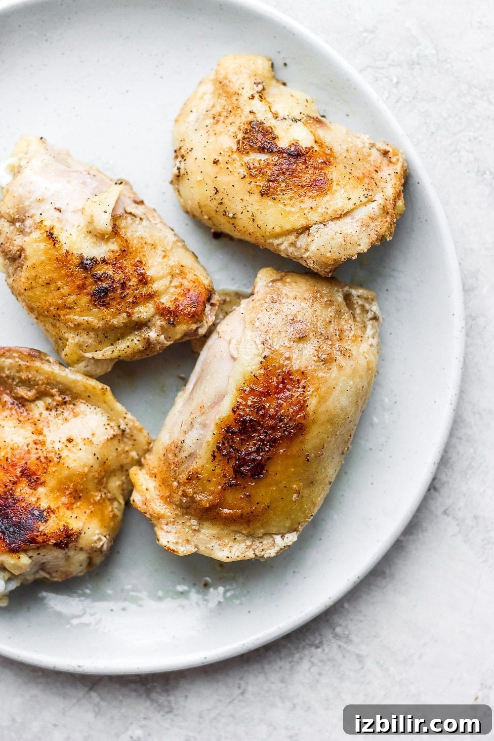 Make our bone-in sous vide chicken thighs. They are perfectly cooked on the inside and crunchy deliciousness on the outside! chicken thighs on plate
