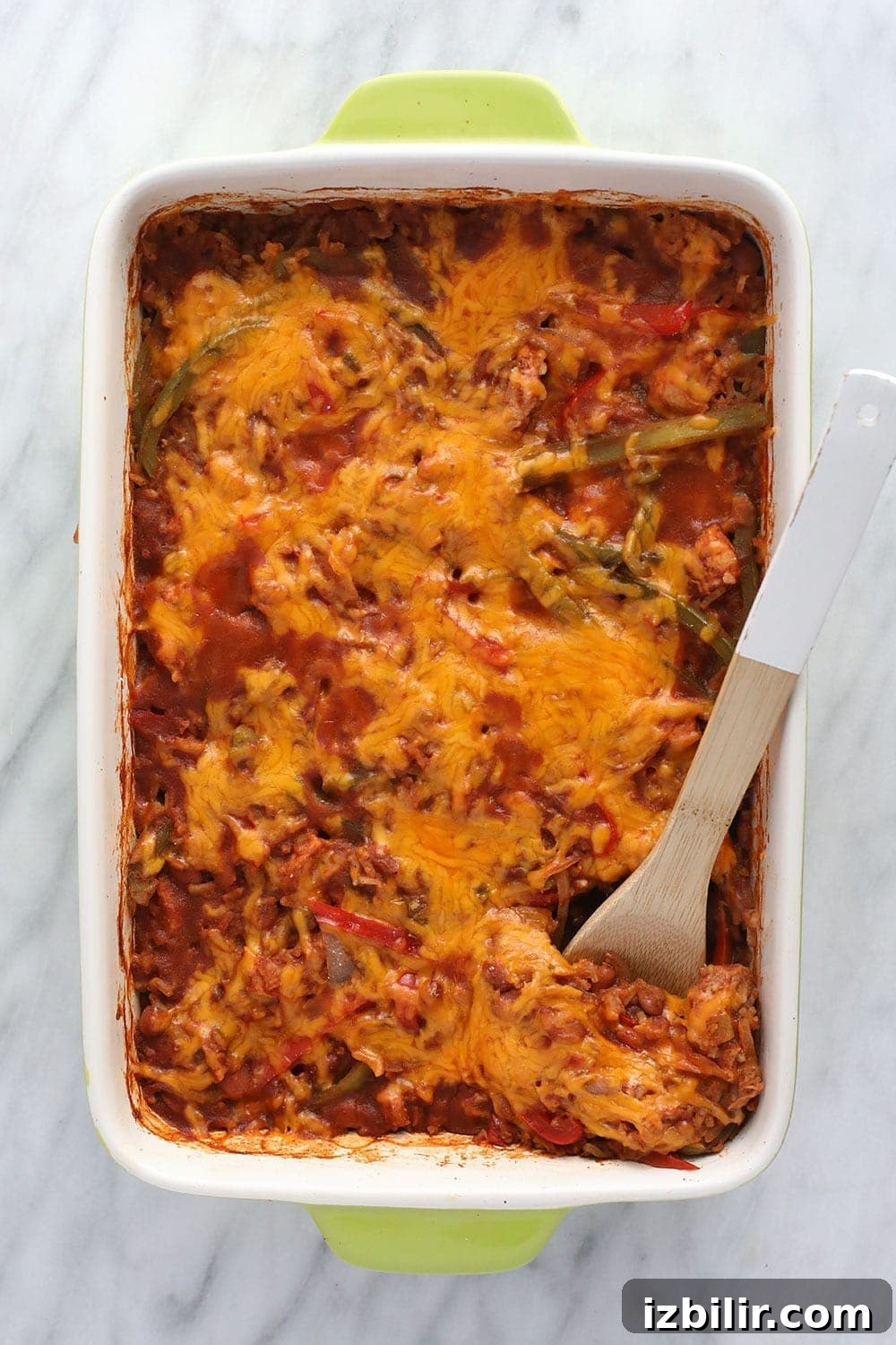 Chicken Burrito Bowl Casserole Ready to Serve chicken burrito bowl casserole in a casserole dish ready to be served