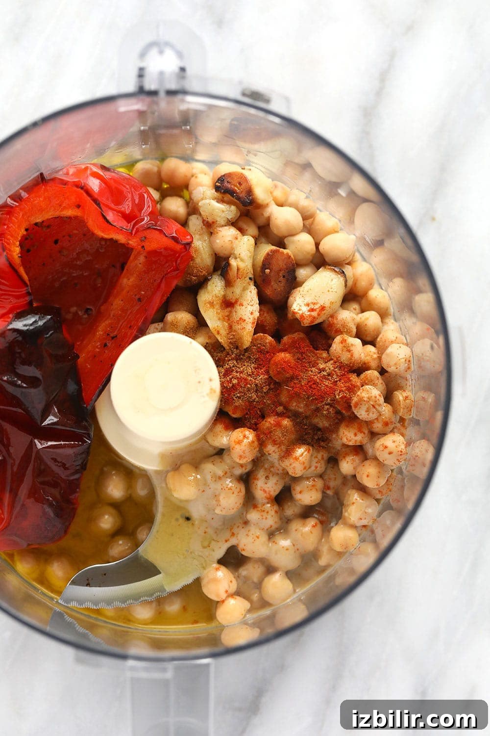 Hummus ingredients in a food processor roasted red pepper hummus ingredients in a food processor ready to be blended