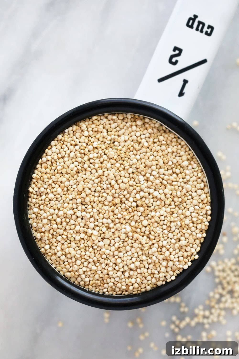 Uncooked quinoa in a measuring cup uncooked quinoa in measuring cup