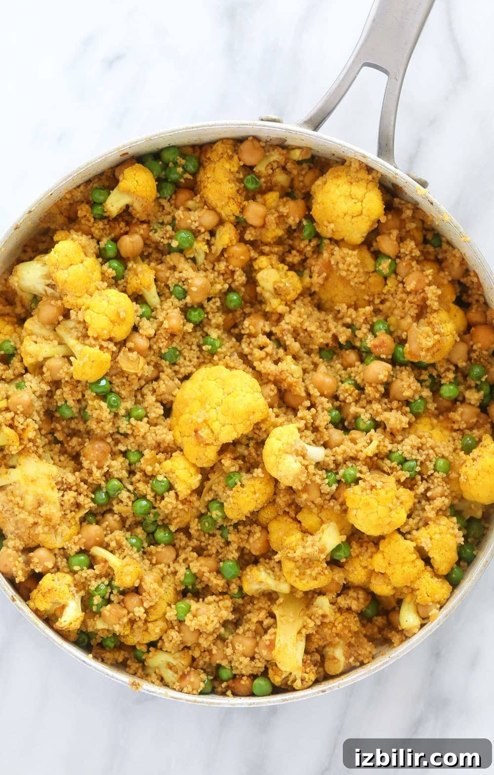 moroccan chickpea couscous in a skillet, ready to be served