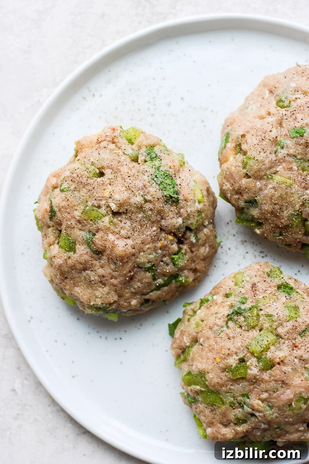 Cooked turkey burger patties patties on plate