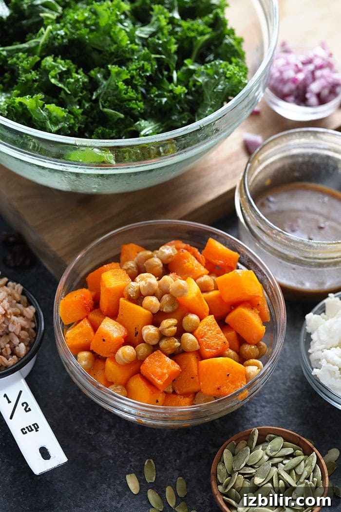 Farro Salad with Kale and Roasted Butternut Squash 2 Roasted butternut squash and chickpeas in a bowl.