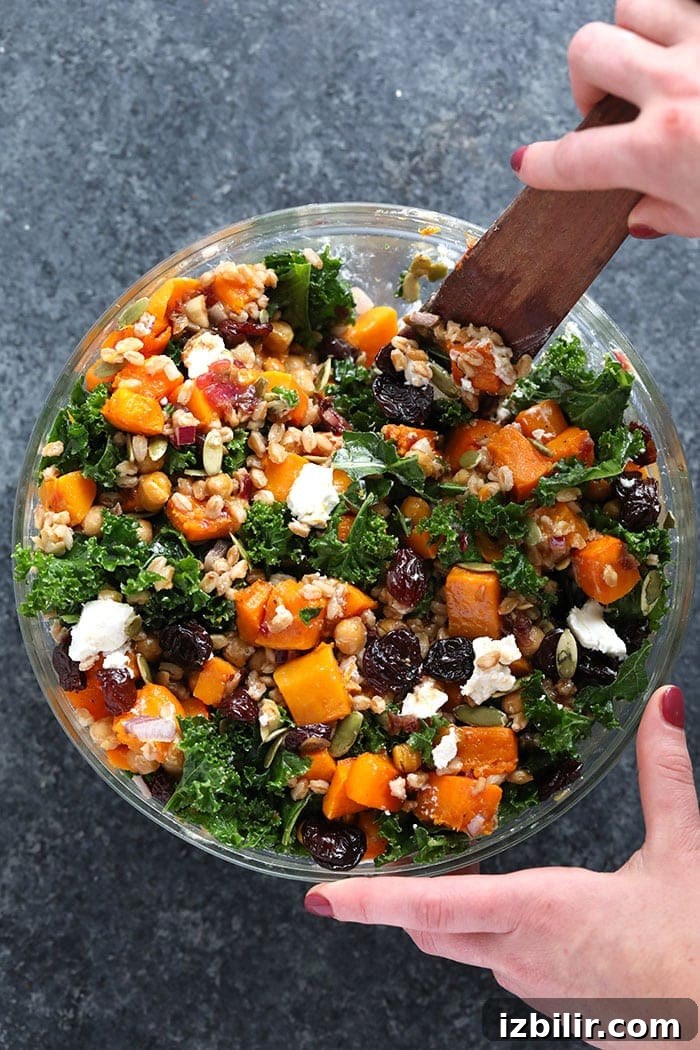 Farro Salad with Kale and Roasted Butternut Squash 7 Stirring the kale and butternut squash salad.
