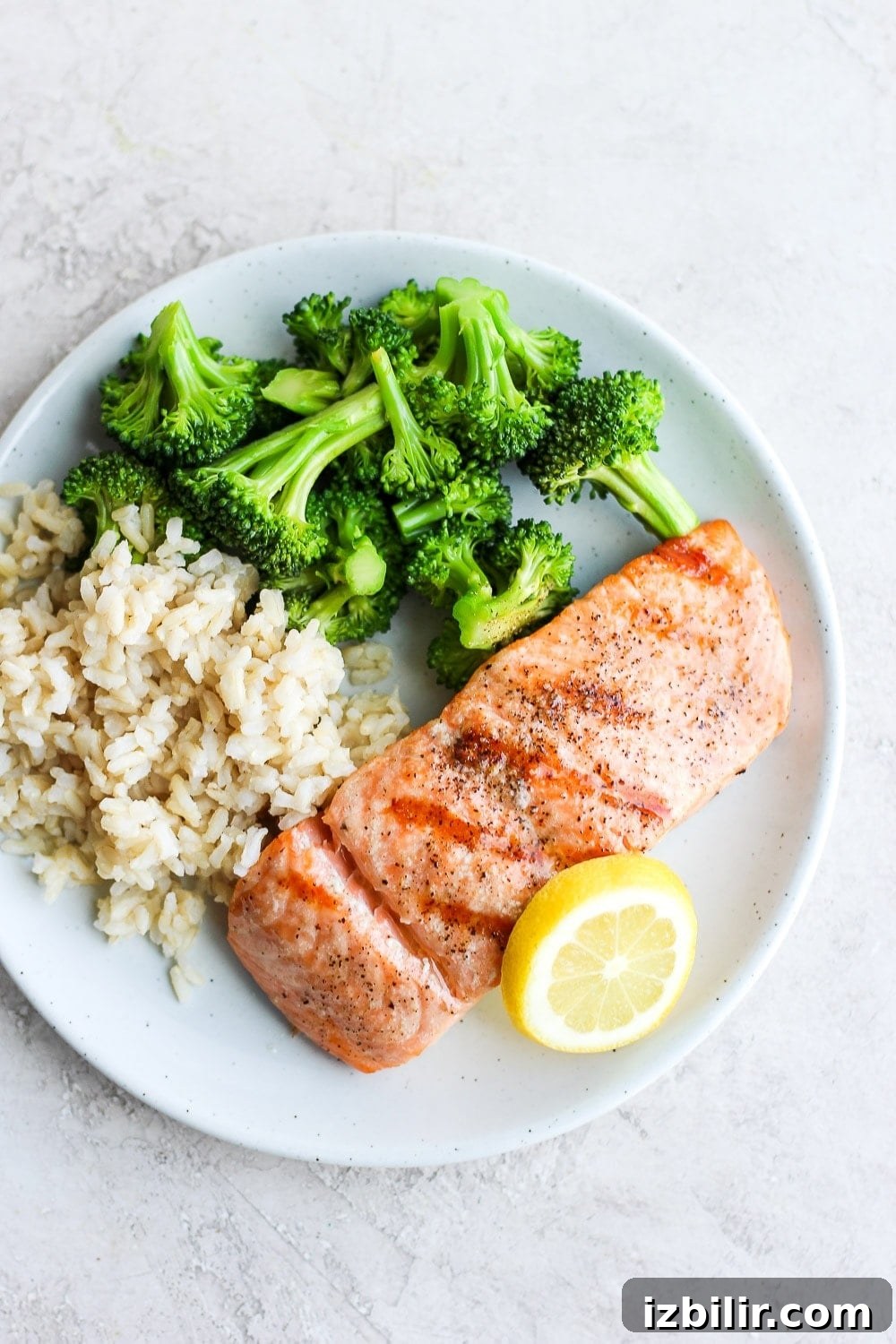 Perfect grilled salmon Grilled salmon on a plate with broccoli and rice.