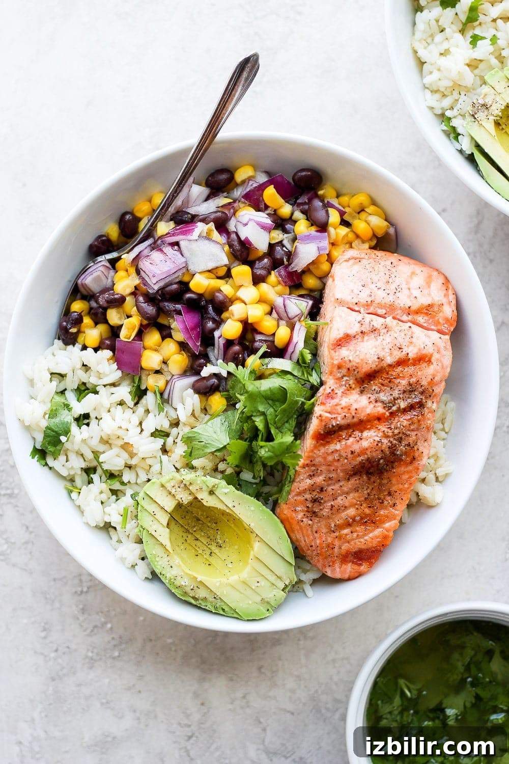 fiesta salmon rice bowls with cilantro lime rice and corn and bean salsa