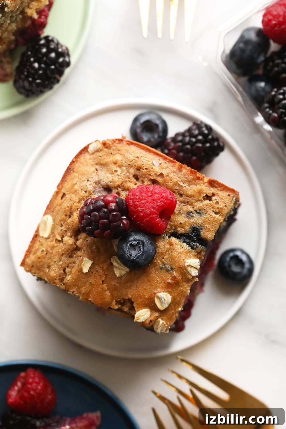 Triple Berry Breakfast Bread Triple berry breakfast bread on a plate.