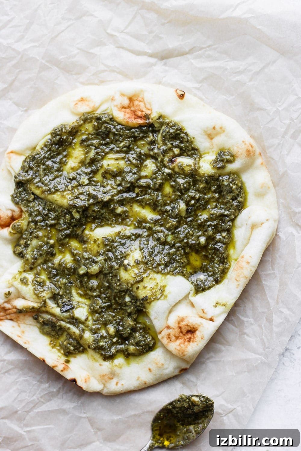 Crispy Naan Breakfast Pizza Recipe with Eggs and Cheese 4 Naan pizza topped with pesto.