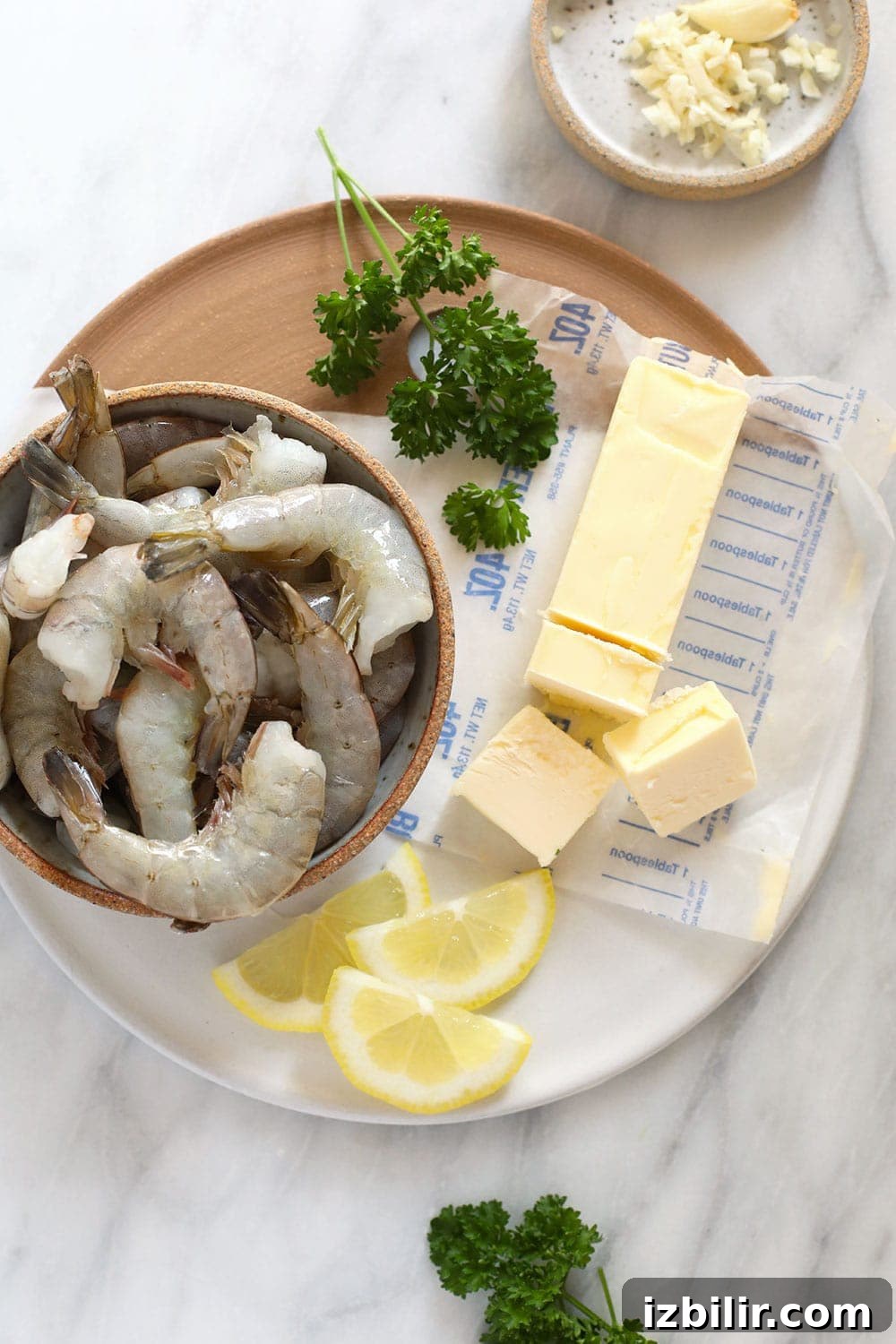 Raw shrimp with butter ready to cook raw shrimp with butter, ready to be sautéed in a skillet