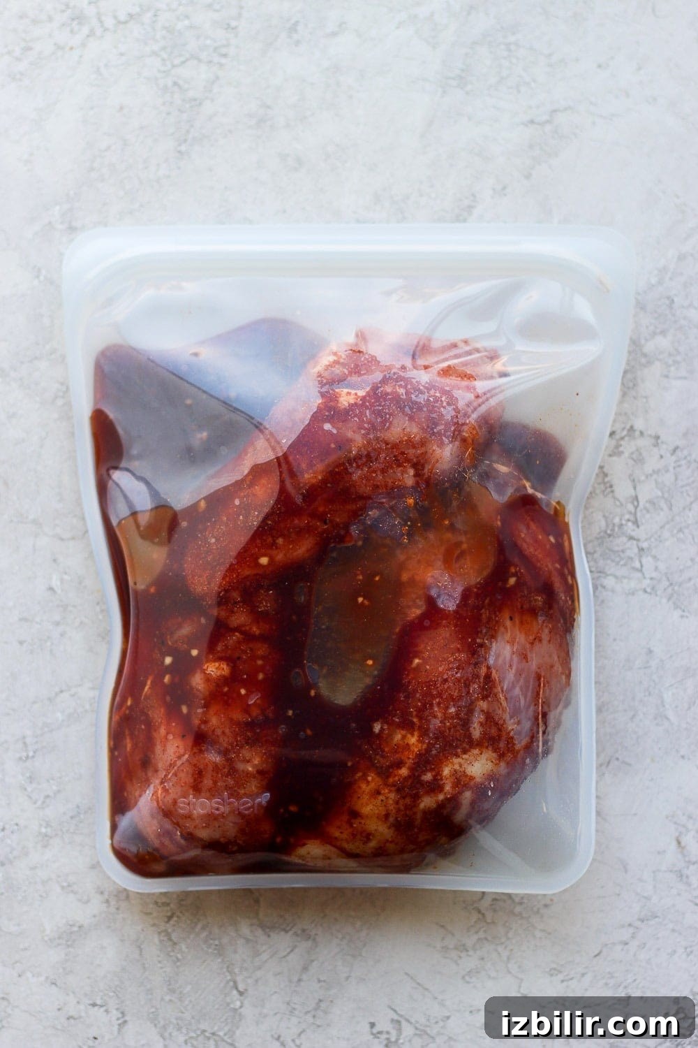 Pork tenderloin marinating in a bag. Marinating pork in a bag.