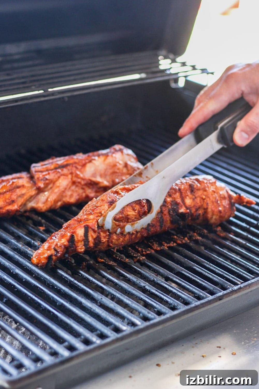 Pork tenderloins grilling. Pork tenderloins on the grill.