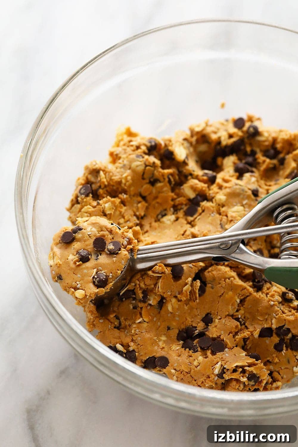 Scooping peanut butter protein balls Scooping peanut butter protein balls