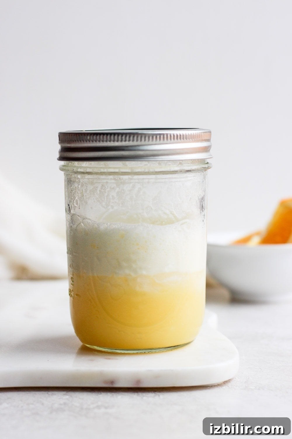 Frothy Orange Creamsicle Cocktail Recipe with Vanilla 4 An orange creamsicle smoothie in a mason jar