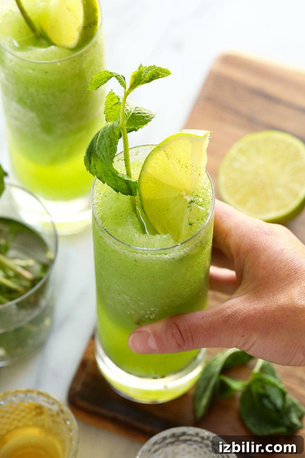 hand holding blended mojito