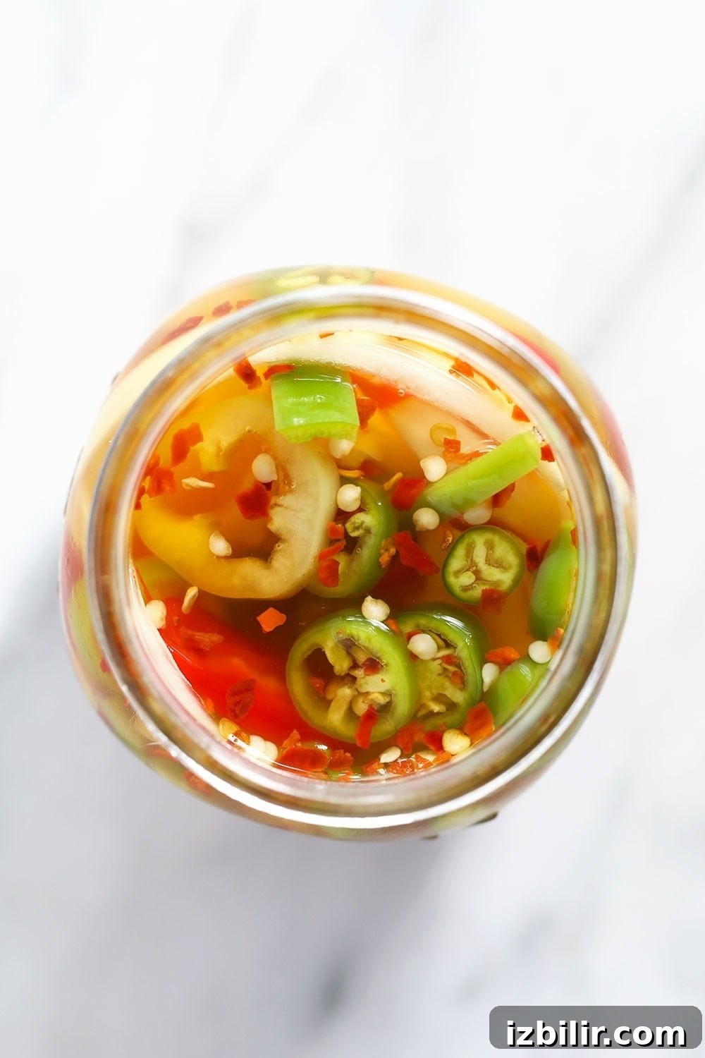 Quick Pickled Hot Peppers Recipe 6 quick pickled peppers in a jar during the pickling process