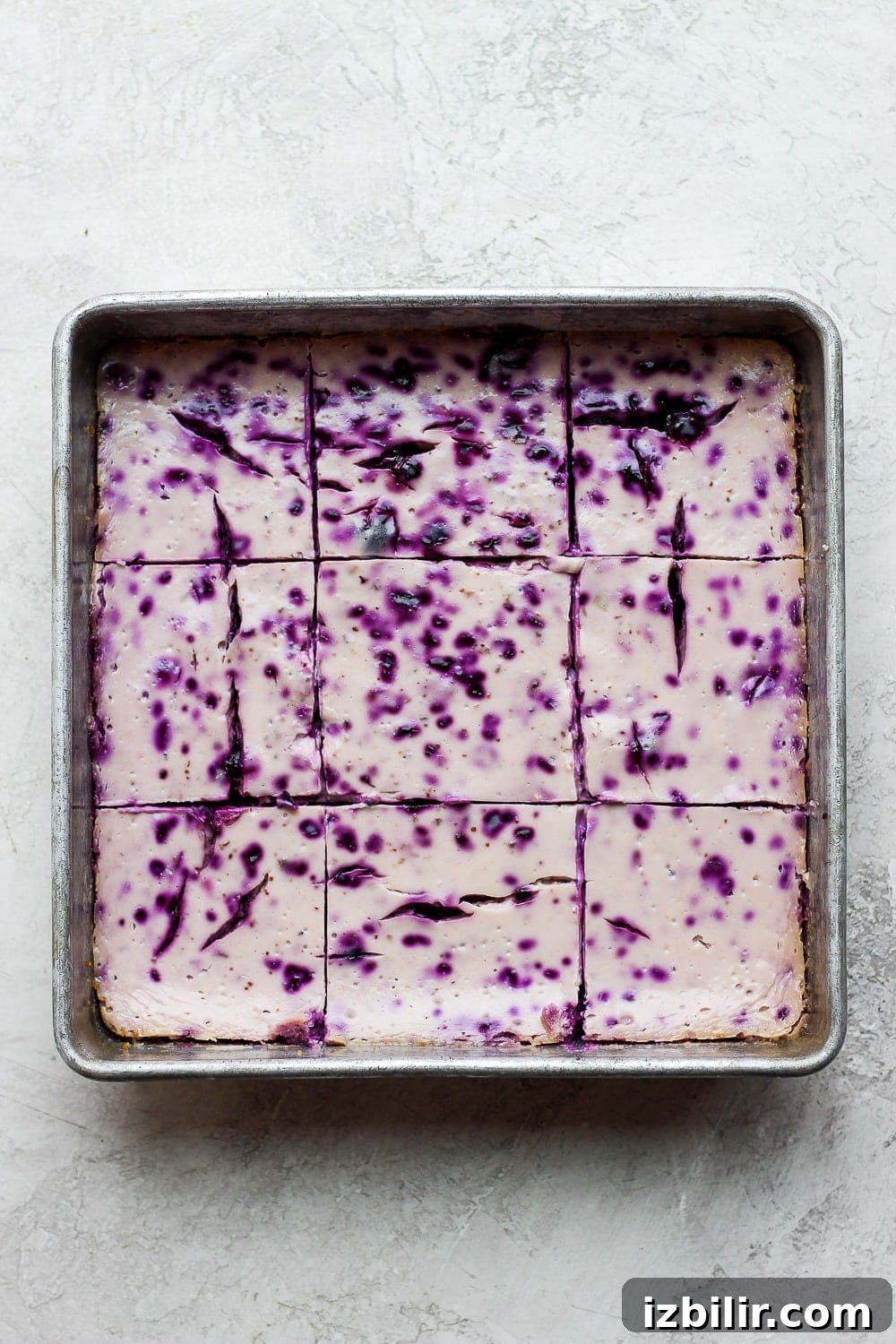 blueberry cheesecake bars after baking in a square baking dish.