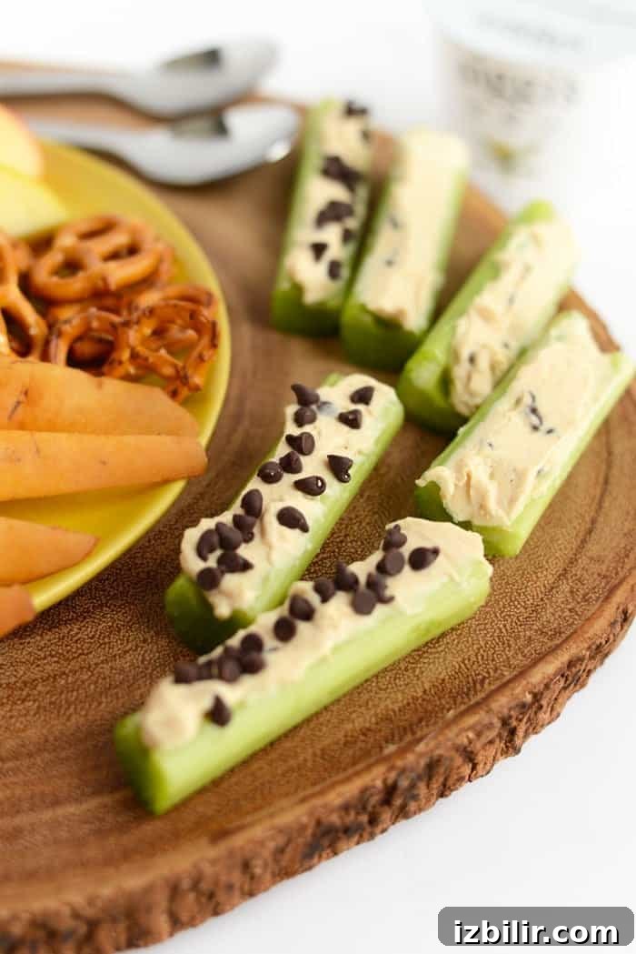 Peanut Butter Greek Yogurt Dip peanut butter greek yogurt dip spread in celery slices for ants on a log