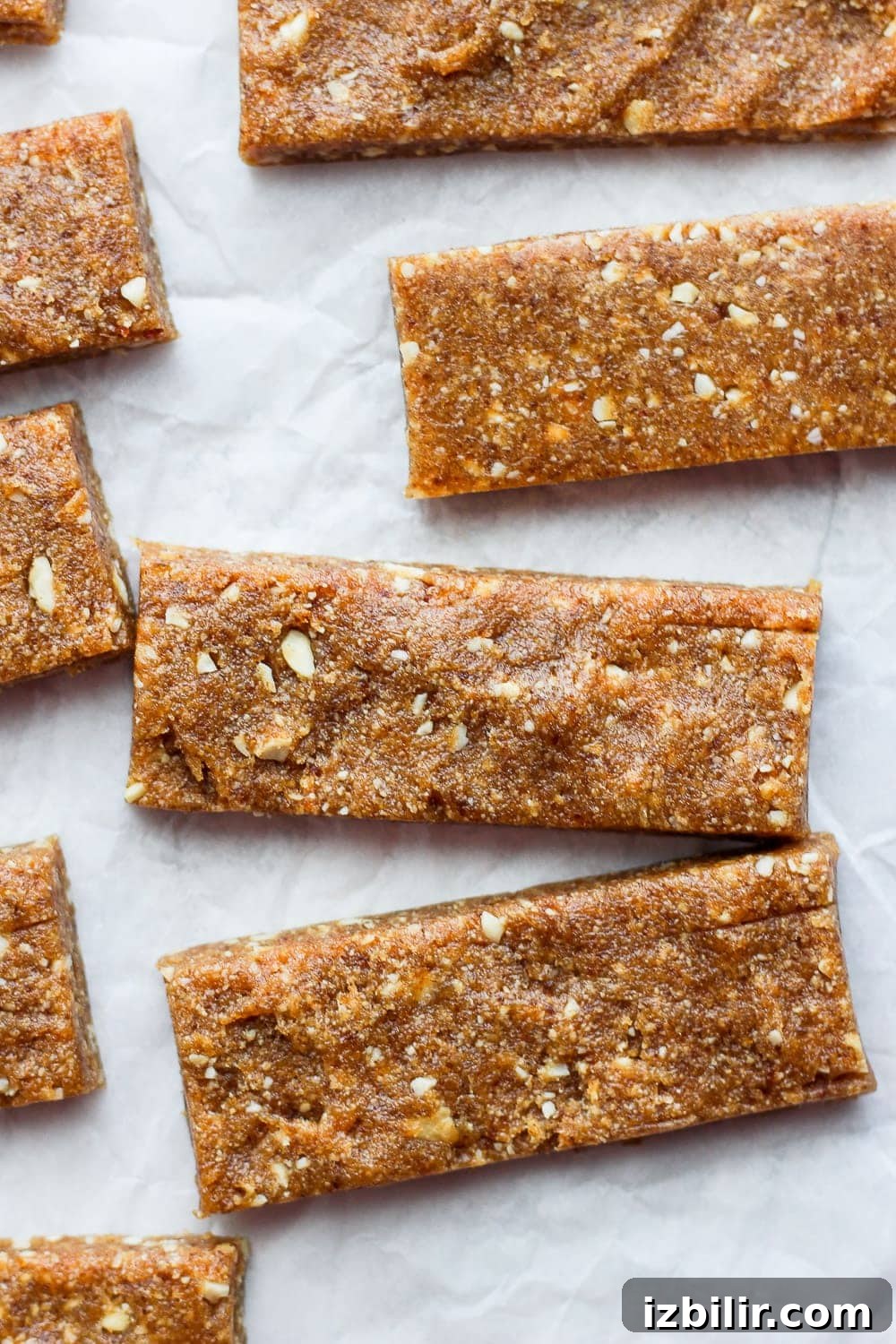 With just 3 simple ingredients you can make these Copycat Cashew Cookie Larabars that are grain-free, refined-sugar-free, vegan, and kid-friendly! larabars on parchment paper