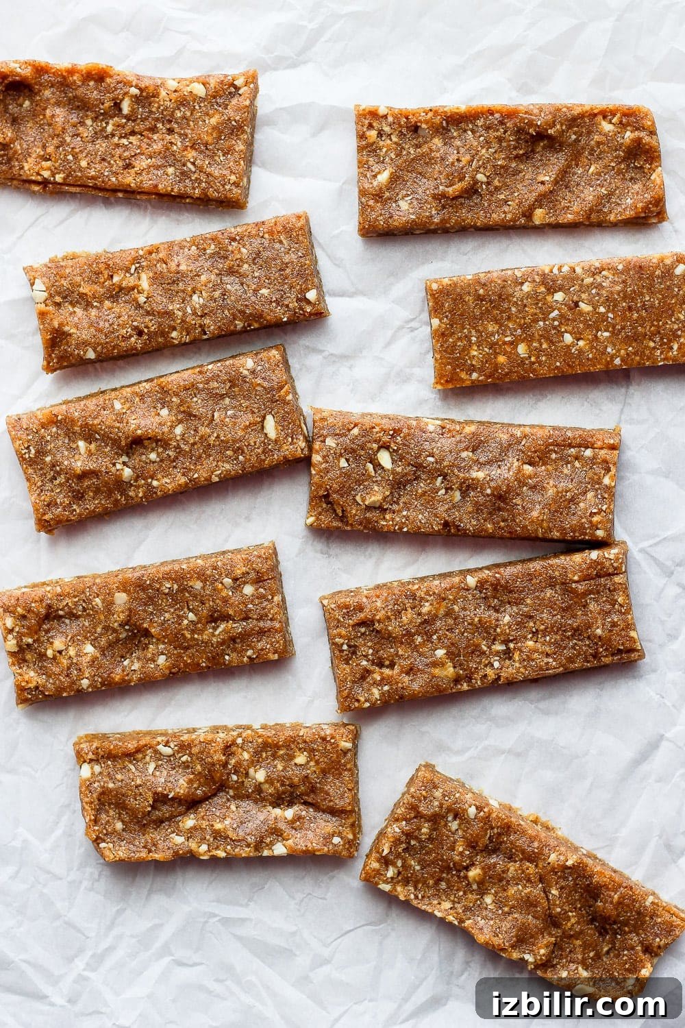 With just 3 simple ingredients you can make these Copycat Cashew Cookie Larabars that are grain-free, refined-sugar-free, vegan, and kid-friendly! larabars on parchment