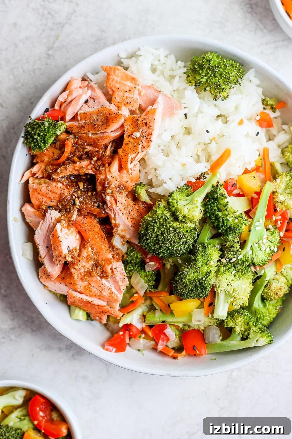Sheet Pan Salmon Stir-Fry with Roasted Vegetables 2 sheet pan salmon stir fry in a bowl with rice