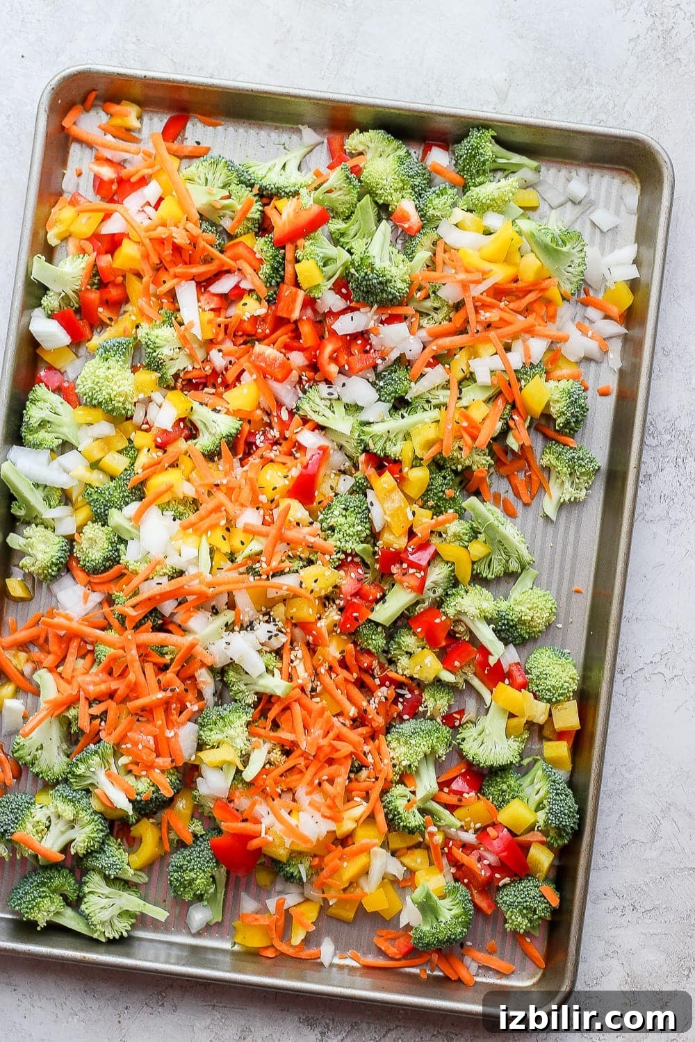 Sheet Pan Salmon Stir-Fry with Roasted Vegetables 3 veggies for sheet pan salmon stir fry ready to be roasted in the oven