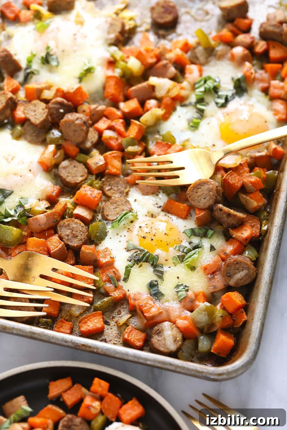 sweet potato hash on baking sheet with forks