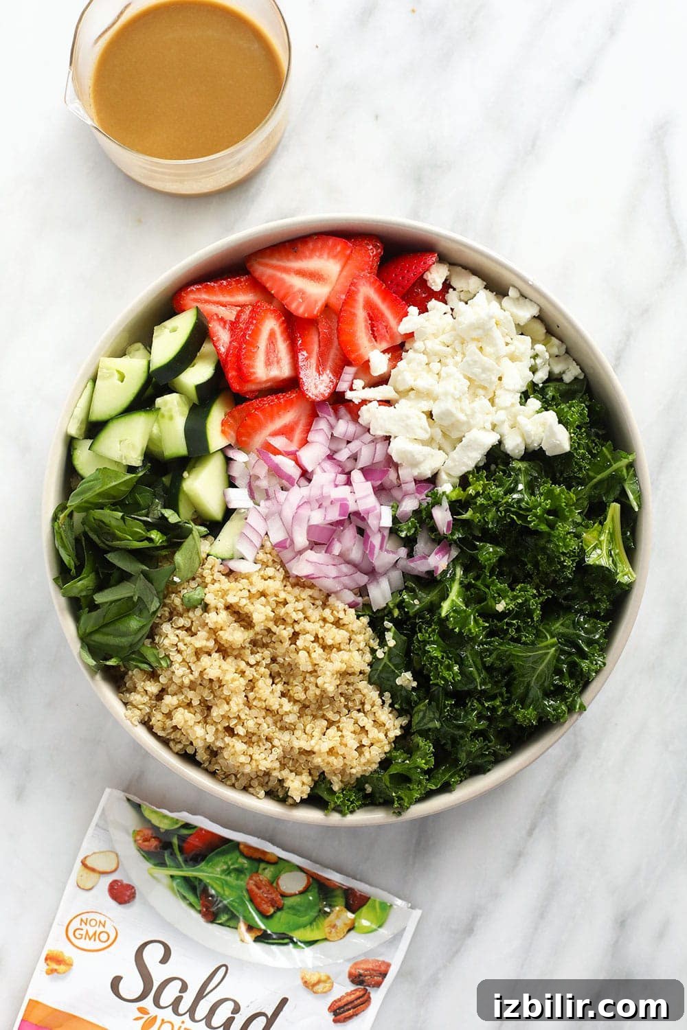 Bowl of quinoa with strawberries and herbs