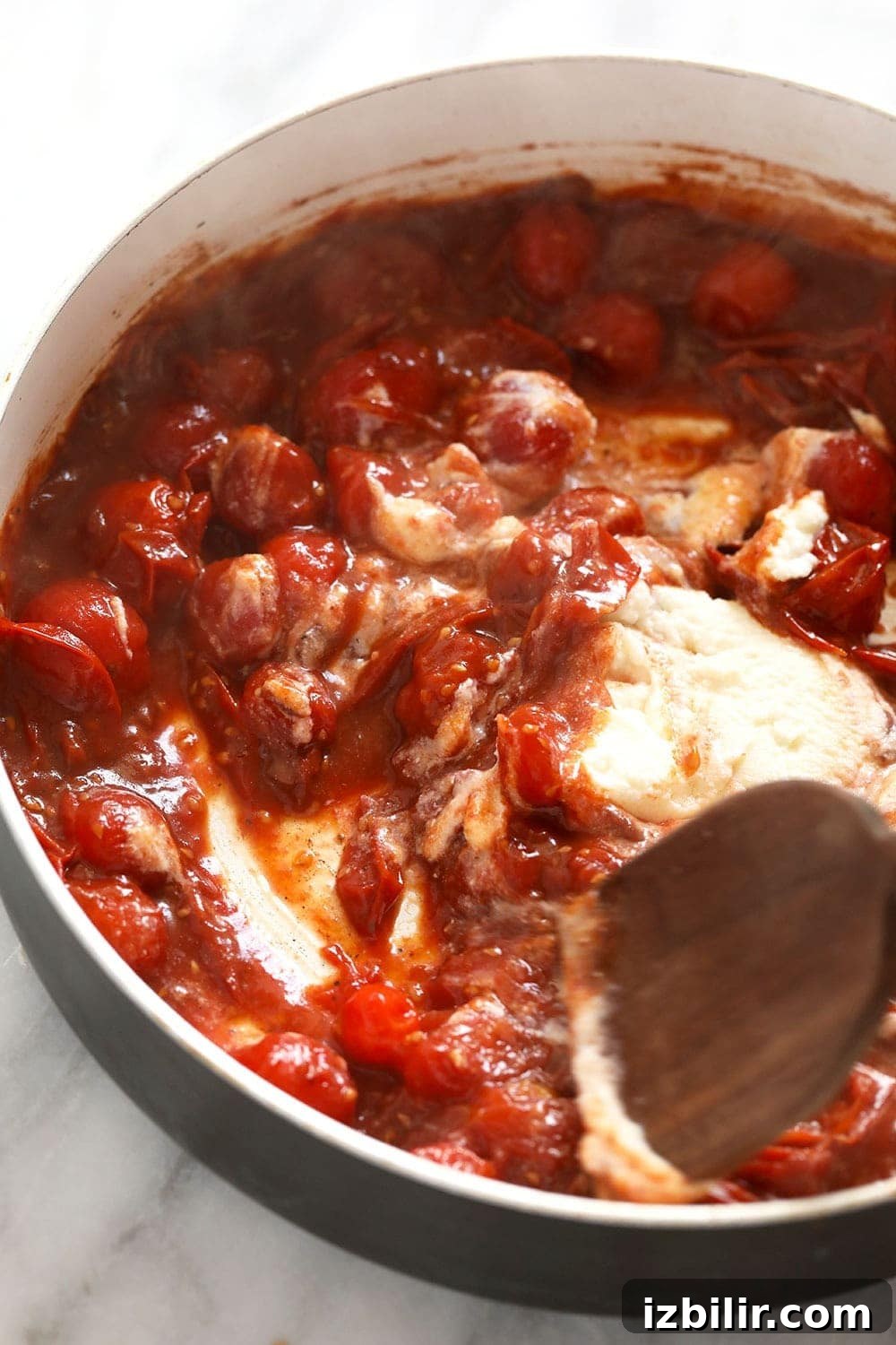 Summer Garden Pasta with Fresh Tomatoes and Herbs 5 Adding ricotta to a skillet pan to make the tomato sauce creamy.