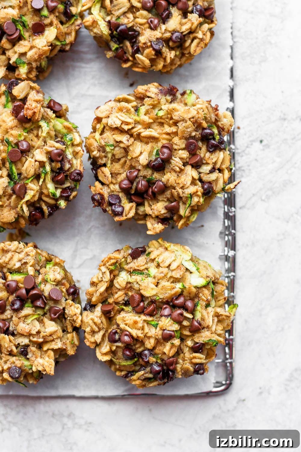 Brown Butter Chocolate Chip Zucchini Oatmeal Cups Recipe 2 Zucchini oatmeal cups on a cooling rack.