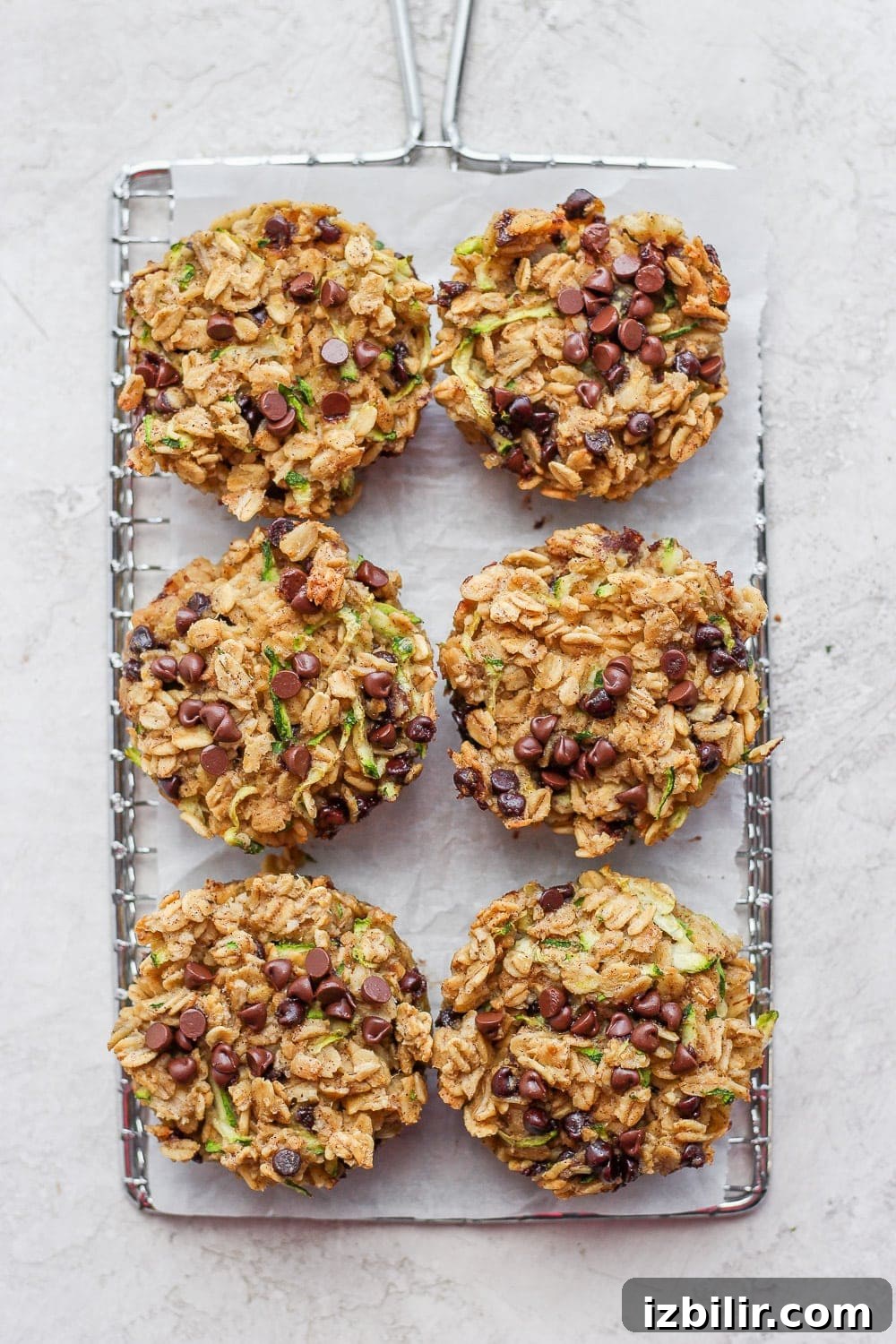 Brown Butter Chocolate Chip Zucchini Oatmeal Cups Recipe 5 Finished zucchini oatmeal cups on a cooling rack.