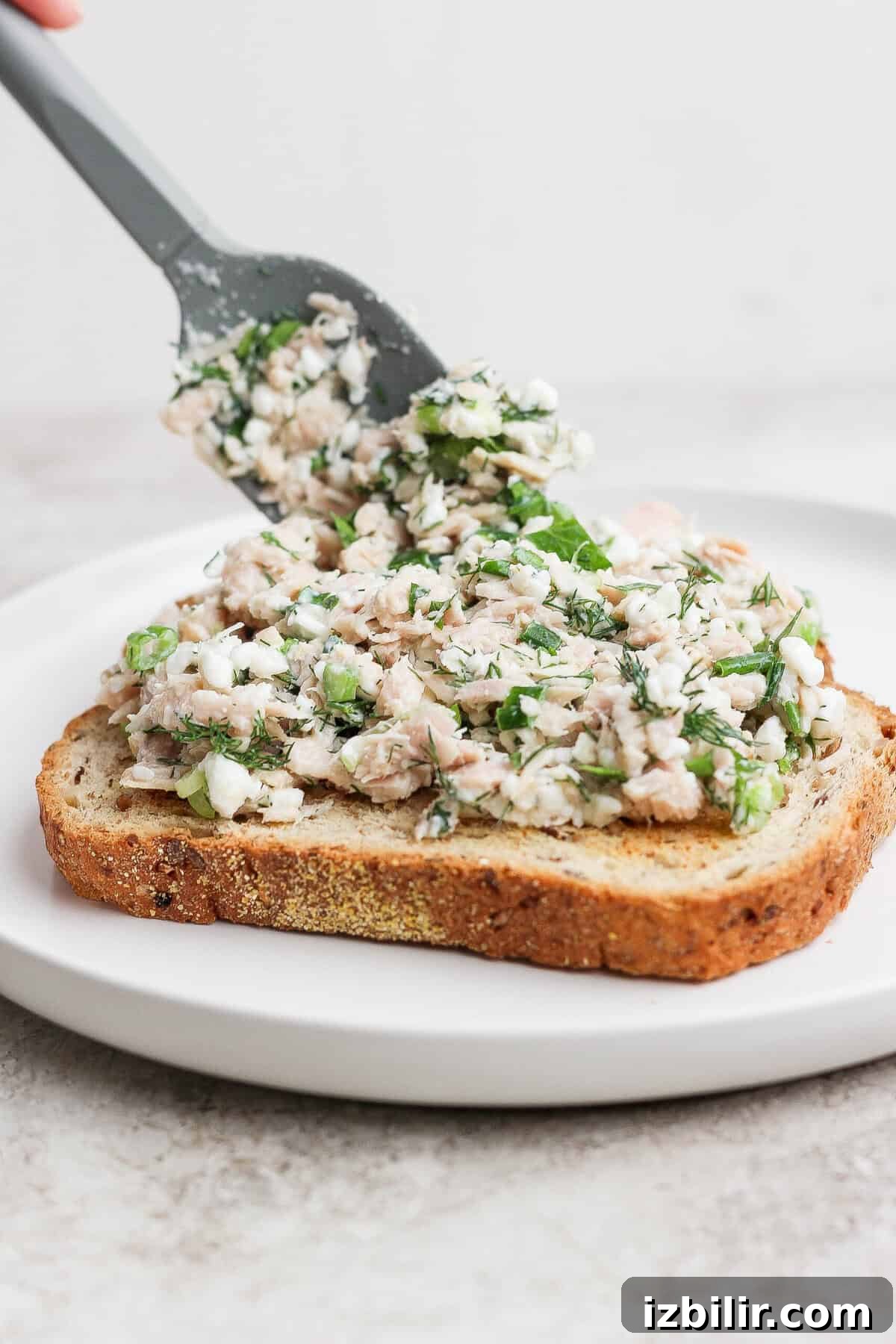 Mayo-Free Tuna Melt with Cottage Cheese 5 spreading cottage cheese tuna salad on sourdough toast