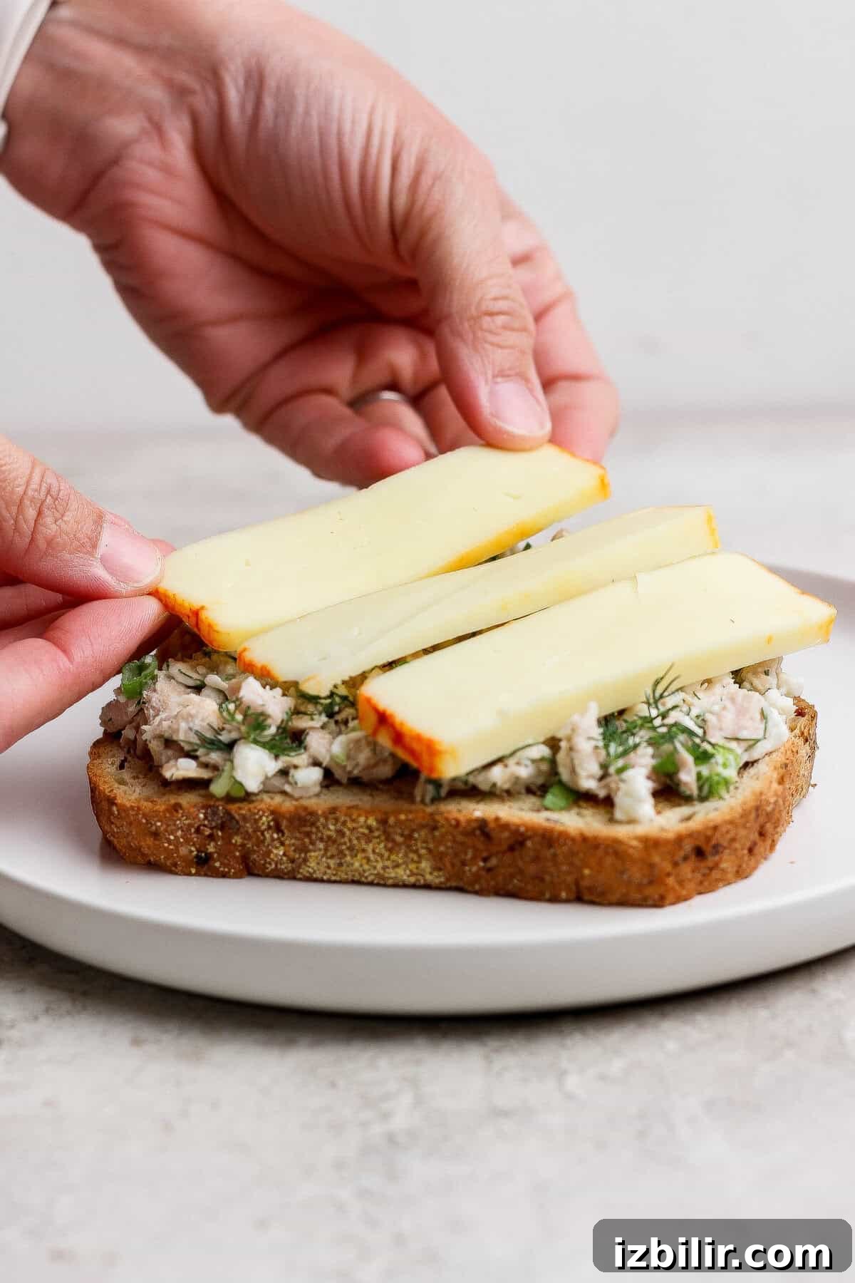 Mayo-Free Tuna Melt with Cottage Cheese 6 placing muenster cheese slices on tuna melt