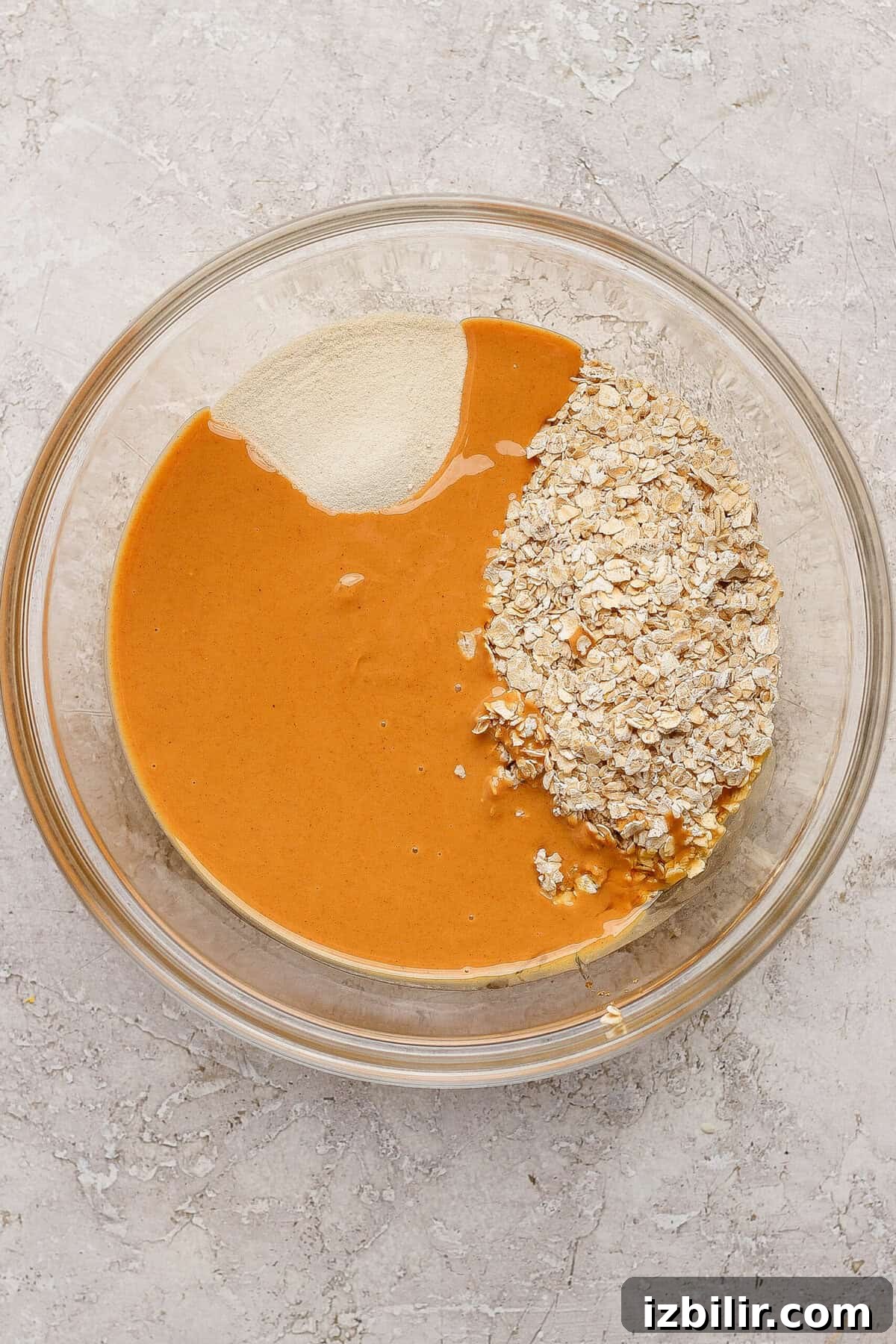 Peanut Butter & Jelly Protein Breakfast Crumble 4 peanut butter oats and protein powder in a mixing bowl for crumble topping