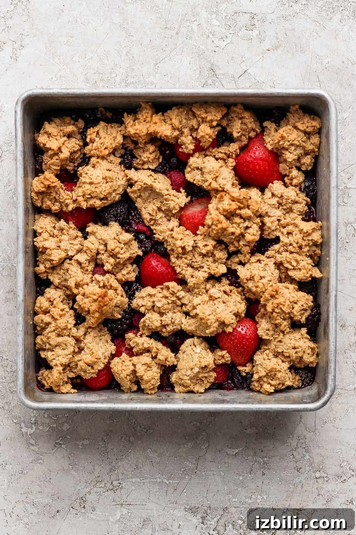 Peanut Butter & Jelly Protein Breakfast Crumble 6 golden brown protein berry crumble fresh out of the oven in a baking pan