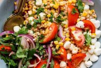 Zesty Summer Corn and Tomato Salad with Chili Crunch Dressing