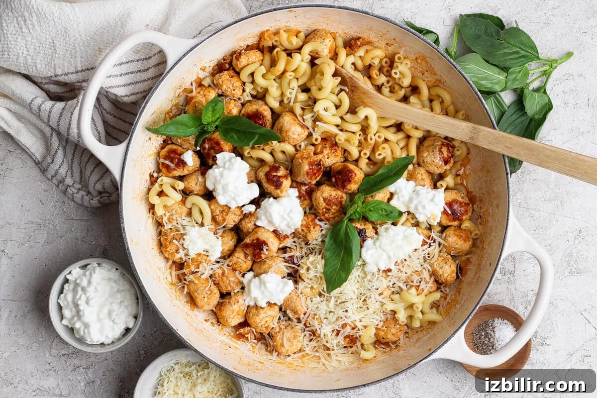 Bite-Sized Cottage Cheese Meatballs with Pasta 2 Skillet of mini cottage cheese meatballs and pasta with Parmesan, cottage cheese, and basil.