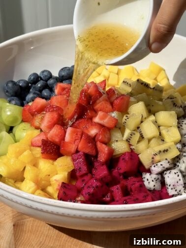 Tropical fruit salad with mango, dragon fruit, pineapple and berries