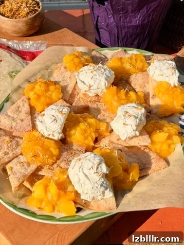 Mango dessert nachos with cempasúchil whipped cream